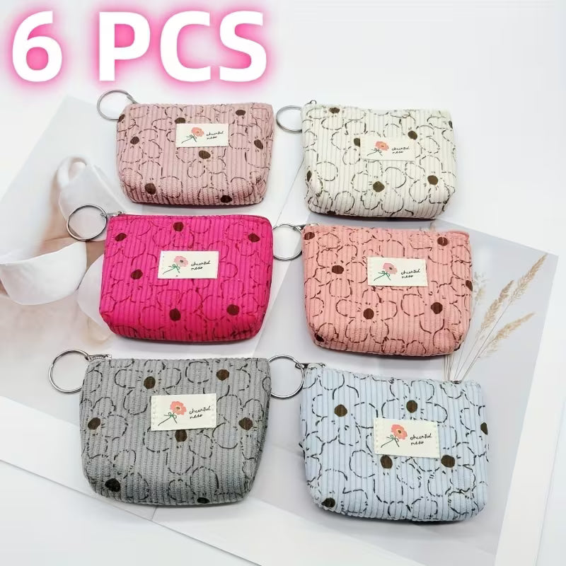 Six patterned coin purses 